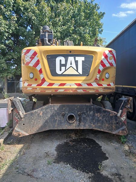 Caterpillar (2015) kolový bagr MH 3022 - fotka 7 z 23