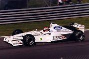 Johny Herbert s vozem SF3 stáje Stewart Grand Prix.