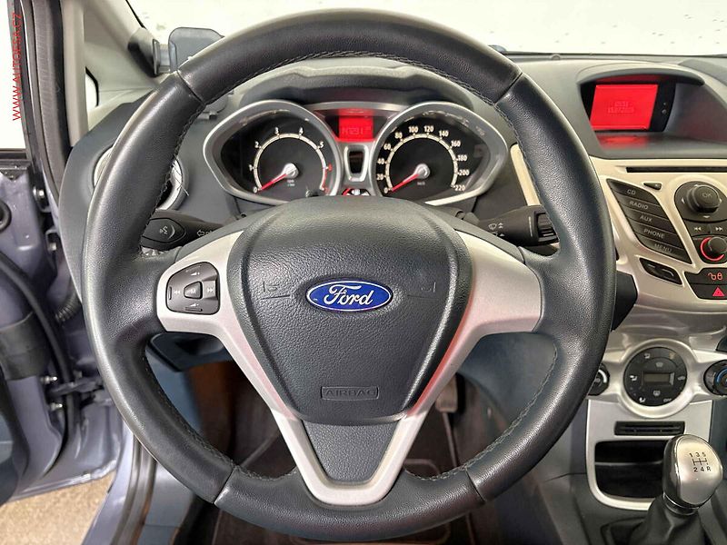 Ford Fiesta (2012) 1.25i, Výhř.sed. - fotka 15 z 15