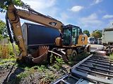 Caterpillar (2015) kolový bagr MH 3022 - náhled 2