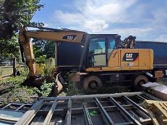 Caterpillar (2015) kolový bagr MH 3022 - fotografie inzerátu