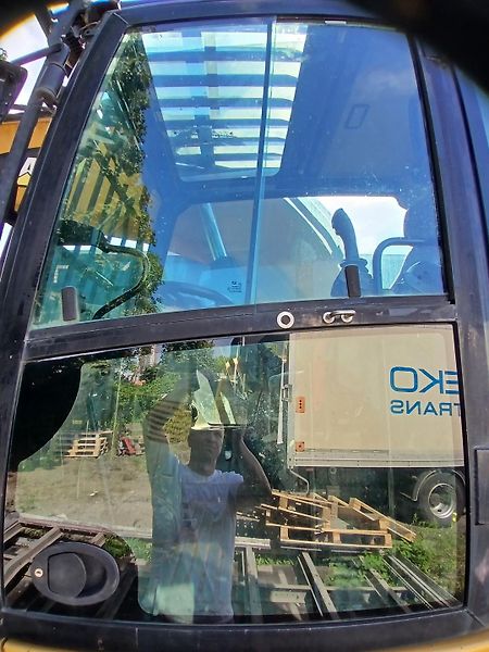 Caterpillar (2015) kolový bagr MH 3022 - fotka 12 z 23
